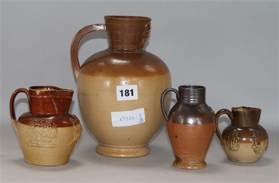 A GI stoneware jug, a Doulton jug and two others 8cm - 22cm